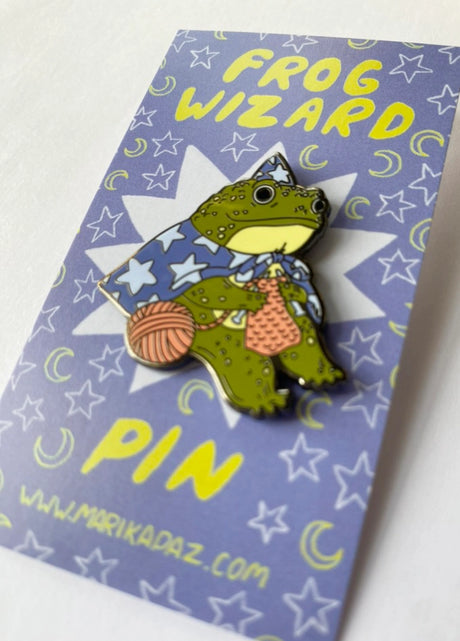 Marika Paz Illustration - Frog Wizard Enamel Pin

A Frog Wizard knits up some spells. This Frog Wizard is a hard enamel pin.

This pin measures approximately 1.50" and features a clasp for easy closure.

The metal outline color is black/gray
