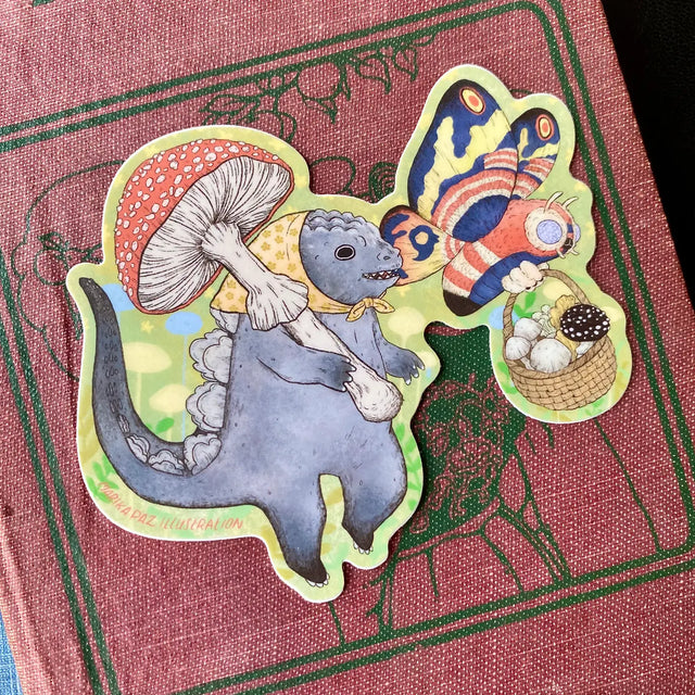 Two little Kaiju friends go foraging for mushrooms together. This vinyl matte sticker is weather and waterproof-stick it on a notebook, bike, or car- it's going to stick around! Heck, throw it on a water bottle and through the dishwasher. This sticker can go anywhere.

Sticker measures 3.9" x 4"

Printed in USA.