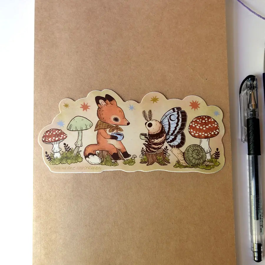 Two friends sit down for tea. This vinyl matte sticker is weather and waterproof-stick it on a notebook, bike, or car- it's going to stick around! Heck, throw it on a water bottle and through the dishwasher. This sticker can go anywhere.

Sticker measures 2.5" x 5.5"

Printed in USA.
