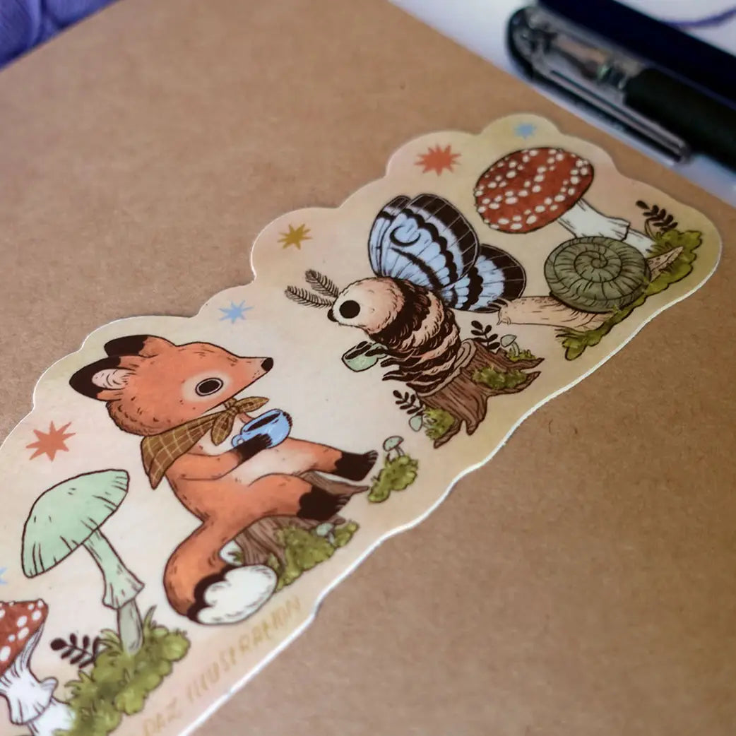 Two friends sit down for tea. This vinyl matte sticker is weather and waterproof-stick it on a notebook, bike, or car- it's going to stick around! Heck, throw it on a water bottle and through the dishwasher. This sticker can go anywhere.

Sticker measures 2.5" x 5.5"

Printed in USA.