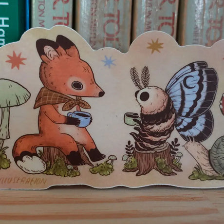 Two friends sit down for tea. This vinyl matte sticker is weather and waterproof-stick it on a notebook, bike, or car- it's going to stick around! Heck, throw it on a water bottle and through the dishwasher. This sticker can go anywhere.

Sticker measures 2.5" x 5.5"

Printed in USA.