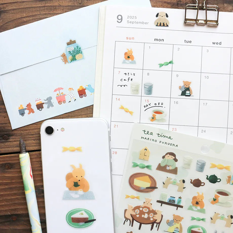 This cute sticker designed by illustrator Mariko Fukuoka looks like a delicious aroma might waft through the air at any moment. Freshly baked cookies served with coffee brewed by a bear barista.


Printed on PET material, the stickers have a smooth, durable finish that’s easy to peel and place - great for both everyday use and special projects.

✨ Product Details

Smooth, durable PET sticker material
Perfect for planners, journals, scrapbooking, and cardmaking
Backing Sheet Size: 141 × 188 mm
Sticker sheet 