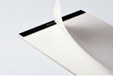 Maruman Mnemosyne A5 Soft Cover Notepad Holder contains a high quality 50 sheet notepad. Made of high quality PVC material, this beautiful black notepad cover is lightweight and slim and fits perfectly in briefcases or backpacks. This is the perfect notepad to write down ideas and plans wherever you are. Durable but soft and flexible protective cover protects the notepad inside.

The notepad is securely placed on the right side of the cover to take notes. The left side pocket is perfect for storing cards or