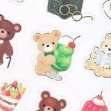 These are transparent stickers with cute relaxed animals and shining gold leaf.
We adorably drew a relaxing bear along with café menu items like cream soda and sweets. Perfect for any journal or planner.



Height 165× Width 90mm
Transparent Stickers

Sticker Gold Foil Stamping Finish

Pattern Backing Card