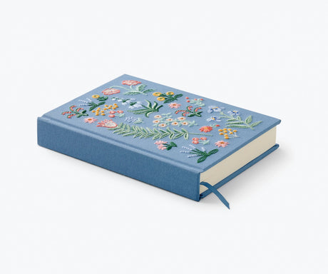 Pretty enough to display, our embroidered journal is perfect for a keepsake journal or diary. With 400 lined pages, there is plenty of space to capture your thoughts.

DETAILS

8" L × 5.75" W
Book cloth cover with 100 gsm ivory uncoated wood free paper