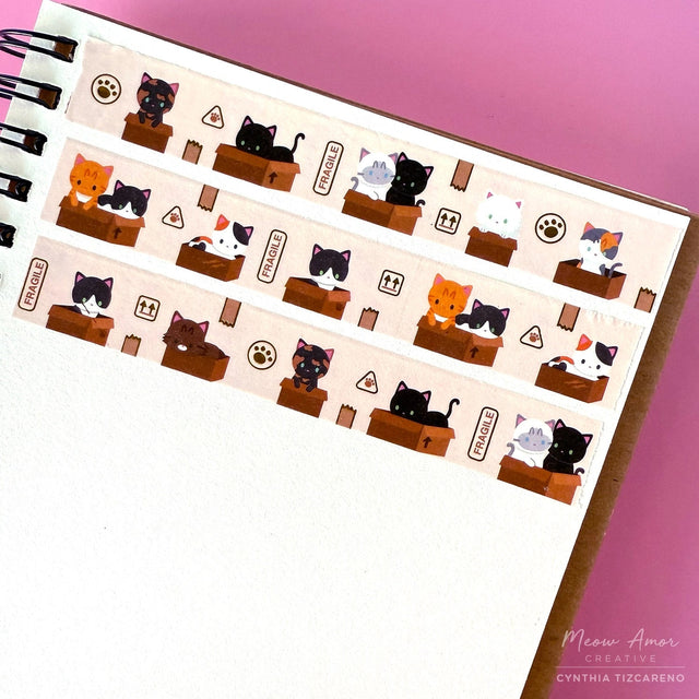 Adorable cats in boxes with gold foil details washi tape. Perfect for gift wrapping, cards, and crafts, it adds instant cuteness to any project. Easy to tear and fun to use!

Gold Foil Details&nbsp;
One 10-meter long roll of washi tape
15mm wide
32mm paper core