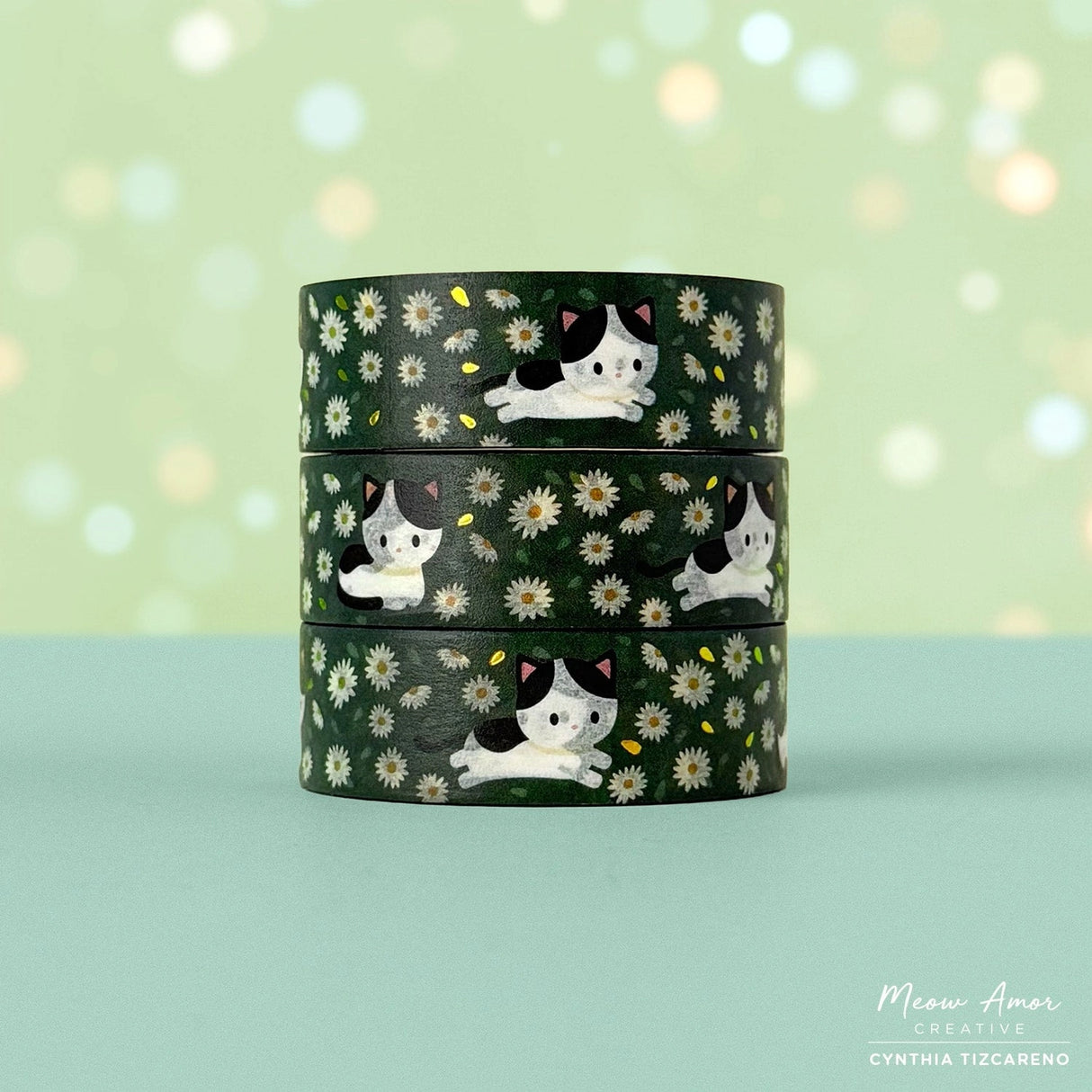 Decorate your projects with the Cow Cat Field Of Flowers Gold Foil Washi Tape. This sweet tape features playful cow-patterned cats surrounded by colorful flowers, highlighted with elegant gold foil details. Perfect for brightening up planners, gifts, and crafts with a gentle, cheerful touch.

Gold Foil Details&nbsp;
One 10-meter long roll of washi tape
15mm wide
32mm paper core