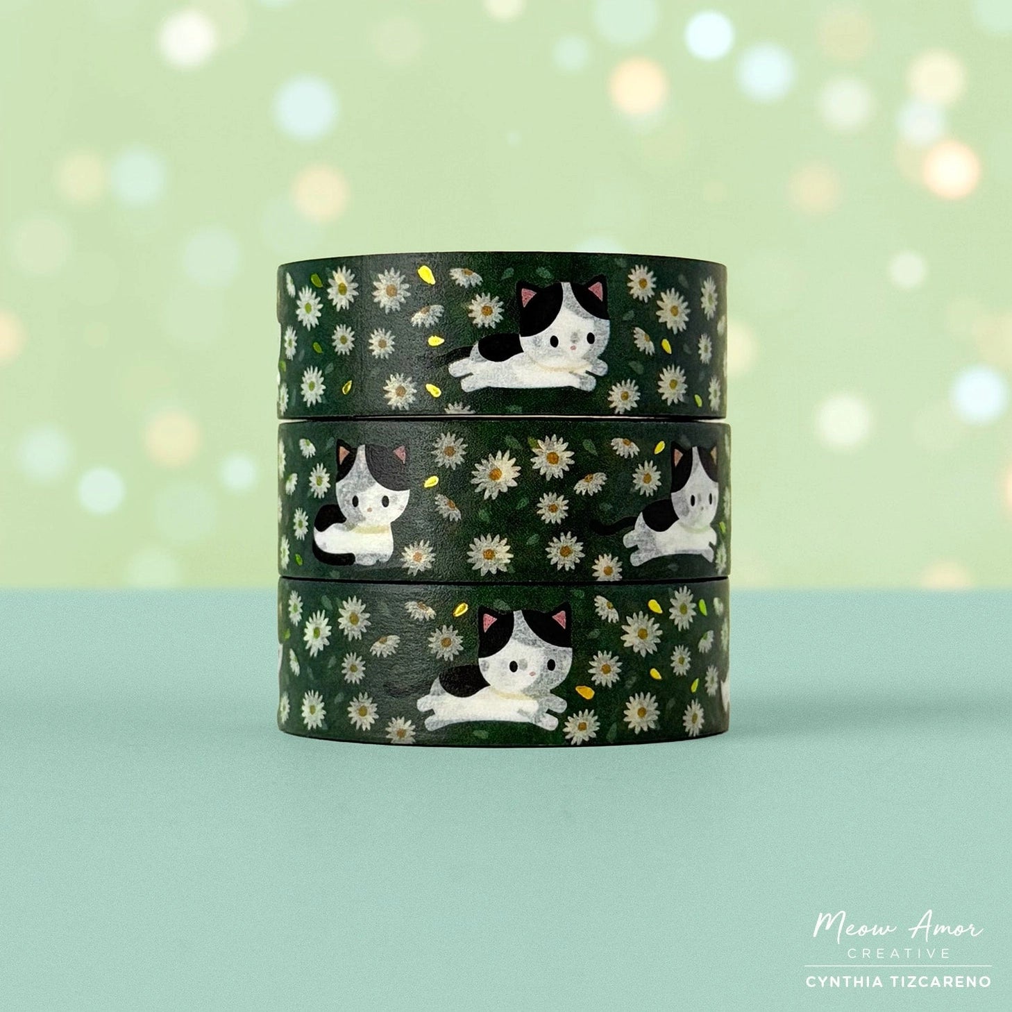 Decorate your projects with the Cow Cat Field Of Flowers Gold Foil Washi Tape. This sweet tape features playful cow-patterned cats surrounded by colorful flowers, highlighted with elegant gold foil details. Perfect for brightening up planners, gifts, and crafts with a gentle, cheerful touch.

Gold Foil Details&nbsp;
One 10-meter long roll of washi tape
15mm wide
32mm paper core