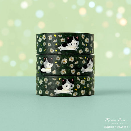 Decorate your projects with the Cow Cat Field Of Flowers Gold Foil Washi Tape. This sweet tape features playful cow-patterned cats surrounded by colorful flowers, highlighted with elegant gold foil details. Perfect for brightening up planners, gifts, and crafts with a gentle, cheerful touch.

Gold Foil Details&nbsp;
One 10-meter long roll of washi tape
15mm wide
32mm paper core