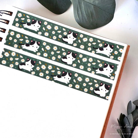 Decorate your projects with the Cow Cat Field Of Flowers Gold Foil Washi Tape. This sweet tape features playful cow-patterned cats surrounded by colorful flowers, highlighted with elegant gold foil details. Perfect for brightening up planners, gifts, and crafts with a gentle, cheerful touch.

Gold Foil Details&nbsp;
One 10-meter long roll of washi tape
15mm wide
32mm paper core