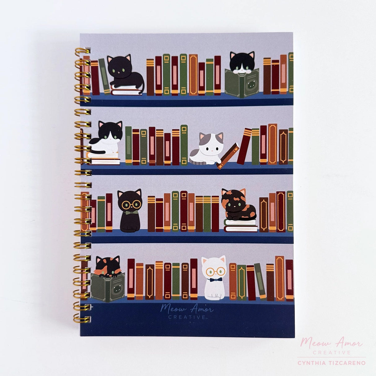 Jot down your notes in the book cats spiral notebook. Featuring book cat design, it's the perfect companion for journaling, sketching, and creative thoughts.