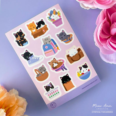 Add charm to your belongings with the I FIt I SIt Vinyl Sticker Sheet. Featuring adorable cats in things they sit in, these stickers are perfect for decorating laptops, water bottles, notebooks, and more. Made from durable vinyl, they resist water and fading, keeping your favorite feline friends looking cute wherever you stick them.