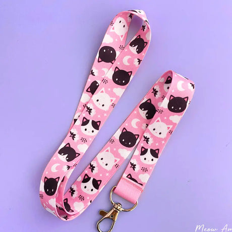 Make sure you never lose your keys again with this Meow Meow Pink Lanyard! Adorably designed with cute black and white cats, this lanyard is sure to bring a smile to your face each time you use it. Its strong and durable construction will keep your keys safe and secure.

2cm X 95cm
double-sided printing
Swiveling Lobster Clasp&nbsp;