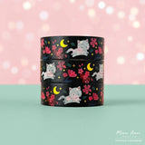 Brighten your crafts with the Floral Fluffy White Cat Gold Foil Washi Tape. Featuring a fluffy white cat surrounded by delicate pink florals set against a sleek black background, this tape is enhanced with shimmering gold foil details for a charming and elegant look. Perfect for adding a sweet, stylish touch to your planners, gifts, and creative projects.

Gold Foil Details&nbsp;
One 10-meter long roll of washi tape
15mm wide
32mm paper core
