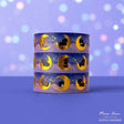 Add a magical glow to your projects with the Moon Cats Gold Foil Washi Tape. Featuring adorable cats surrounded by moon and star designs, this tape shines with elegant gold foil accents. Perfect for adding a cute, celestial touch to planners, gifts, and crafts.

Gold Foil Details&nbsp;
One 10-meter long roll of washi tape
15mm wide
32mm paper core