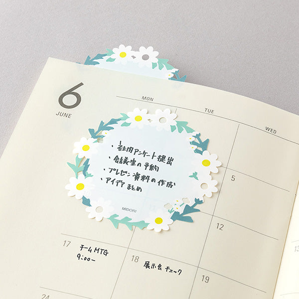 The "Wreath" design features delicate white florals in a wreath. It has a simple and easy-to-write design. If you peek out the die-cut part from a notebook or notebook, you can even use it like a bookmark.&nbsp;

The bottom of the sticker is glued, and when attached, the top floats slightly. The glue part is cut out as little as possible to prevent tearing when flipped.

Includes 20 notes in each package