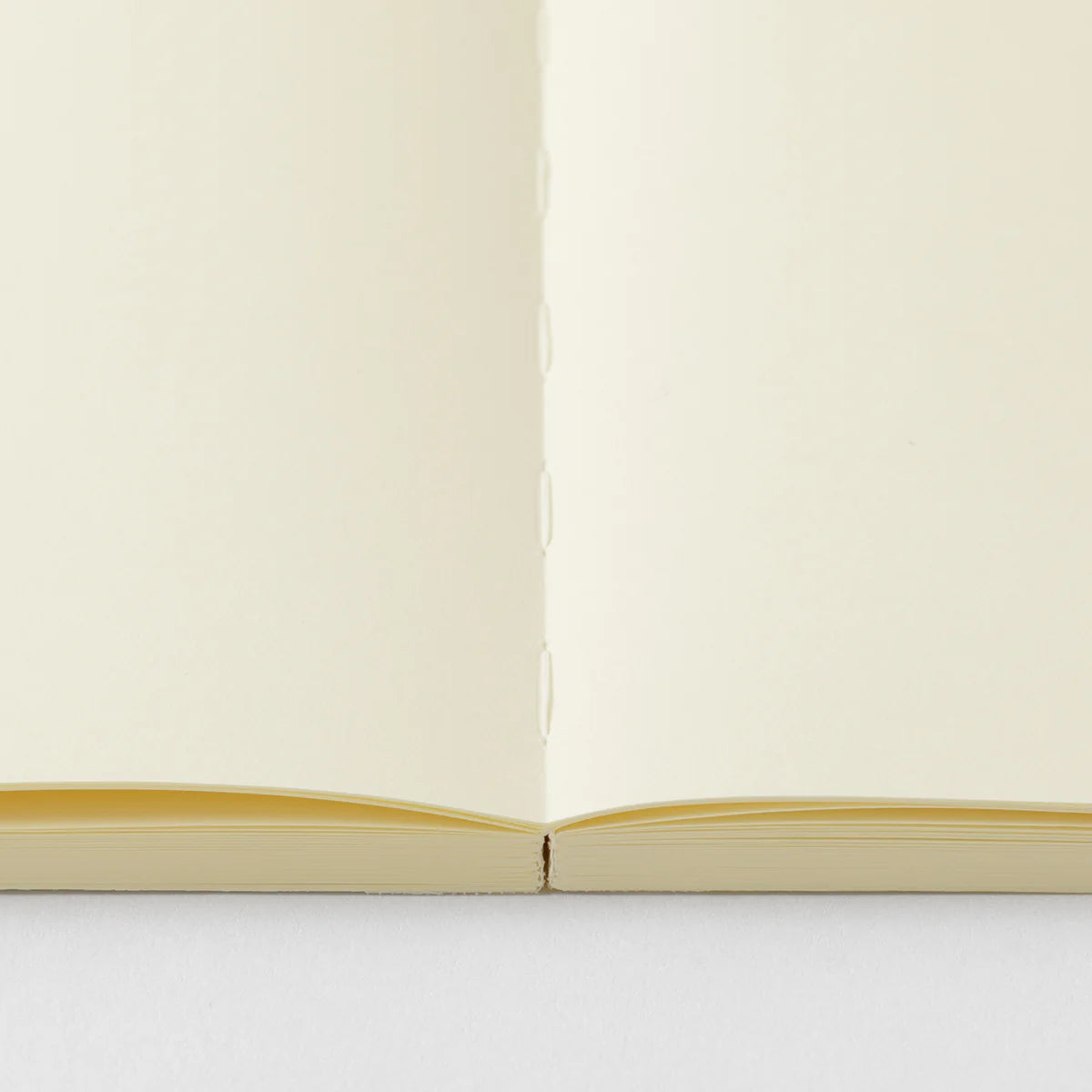 Crafted in Japan, this minimalist notebook is designed to enhance your writing experience. Inside, you'll find the high-quality Midori Diary (MD) paper, first developed in 1960 and refined ever since. Midori has rigorously tested this paper with various writing instruments to ensure quality, checking for ink feathering or bleeding, drying time, the smoothness of pen tips on the surface, and the tactile feel. The result is a paper that resists bleeding and feathering and is fountain-pen friendly, ensuring a 