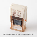 This fun rotating stamp by Midori allows you to choose from several designs and patterns that come with each stamp. The rotating stamp comes with an ink pad to be installed into the stamp before beginning to use it. This is a brown ink (soft color type) that blends well with the colors and decorations of writing instruments. Lock buttons on the side of the stamp allow you to lock the stamp into place when changing out the ink pad and when changing between designs to avoid mess.

These stamps are a great too