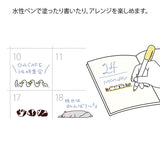 This fun rotating stamp by Midori allows you to choose from several designs and patterns that come with each stamp. The rotating stamp comes with an ink pad to be installed into the stamp before beginning to use it. This is a brown ink (soft color type) that blends well with the colors and decorations of writing instruments. Lock buttons on the side of the stamp allow you to lock the stamp into place when changing out the ink pad and when changing between designs to avoid mess.

These stamps are a great too