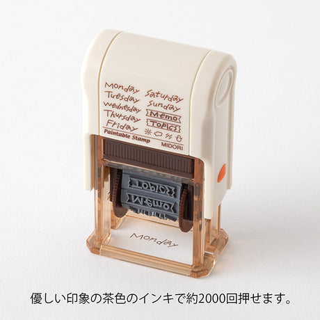 This fun rotating stamp by Midori allows you to choose from several designs and patterns that come with each stamp. The rotating stamp comes with an ink pad to be installed into the stamp before beginning to use it. This is a brown ink (soft color type) that blends well with the colors and decorations of writing instruments. Lock buttons on the side of the stamp allow you to lock the stamp into place when changing out the ink pad and when changing between designs to avoid mess.

These stamps are a great too