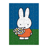 Discover the charm of Miffy, Dick Bruna's iconic character beloved by generations worldwide. Created in 1955 from bedtime stories told during a vacation in the Netherlands, Miffy has become a global icon. Send a puzzle in the mail to someone you love with the Miffy with Flowers Greeting Card Puzzle. Simply write your note on the back of the assembled puzzle, break apart the pieces, and seal the envelop before mailing to your loved one! Only 60 pieces and perfect for Miffy enthusiasts of all ages, it deliver