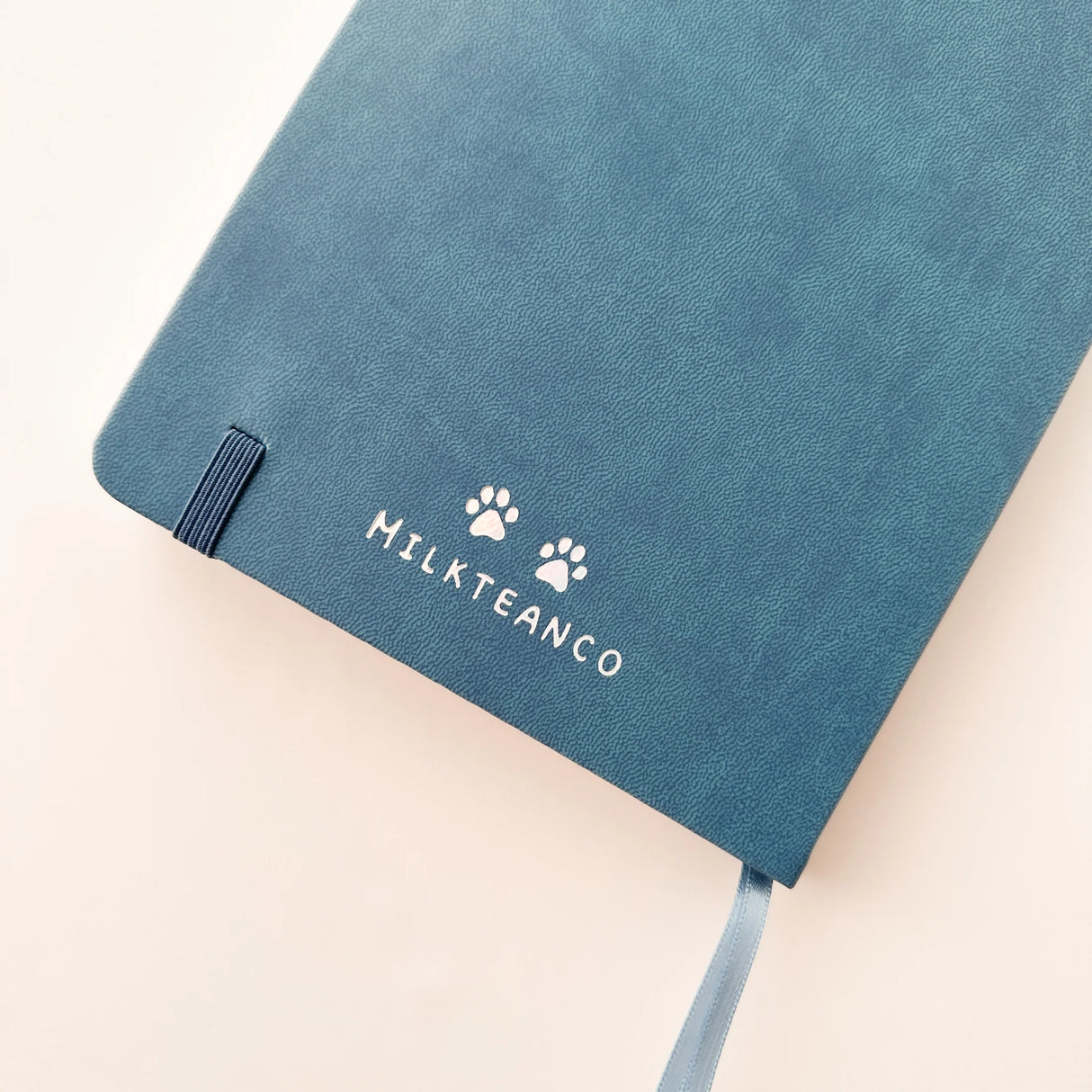 Jiji The Cat Journal in Ocean Blue with Holographic Edges and Logo 🌊✨

Product Details:

Size: A5 (5.70 x 8.26 inches)
160 Dotted Grid Pages (5 x 5 mm)
2 Bookmarks
Elastic Band and Pen Holder
Expandable storage compartment