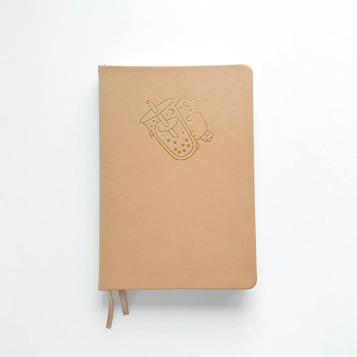 Milk Tea Journal in a beautiful, rich boba colour 🧋 with Gold Foil Logo ✨

Product Details:

Size: A5 (5.70 x 8.26 inches)
160 Dotted Grid Pages (5 x 5 mm)
2 Bookmarks
Elastic Band and Pen Holder
Expandable storage compartment