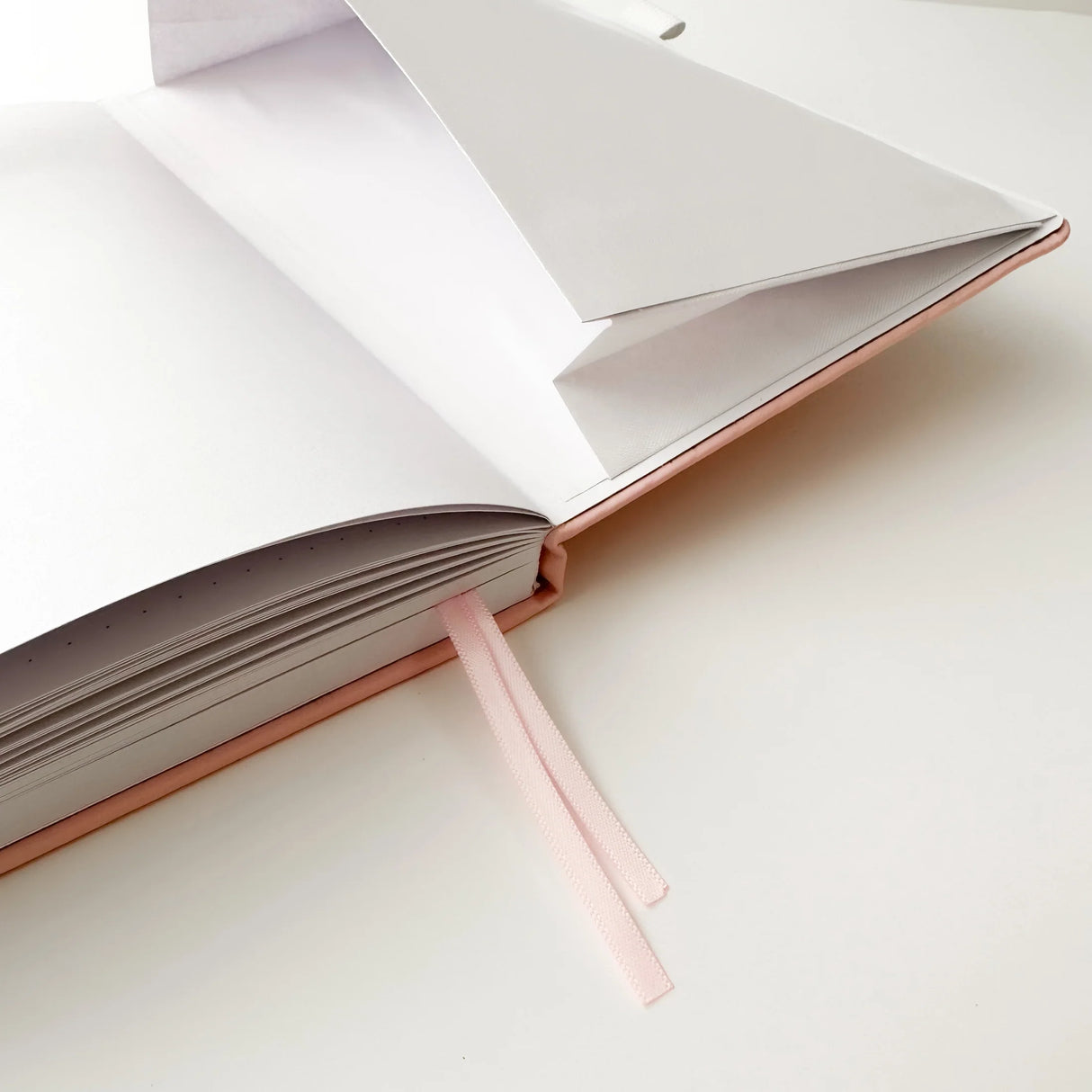Soft pastel vegan leather bullet journal with delicate gold foil details, made to make your everyday planning feel a little more special ✨

Product Details:

Size: A5 (5.70 x 8.26 inches)
160 Dotted Grid Pages (5 x 5 mm)
2 Bookmarks
Elastic Band and Pen Holder
Expandable storage compartment