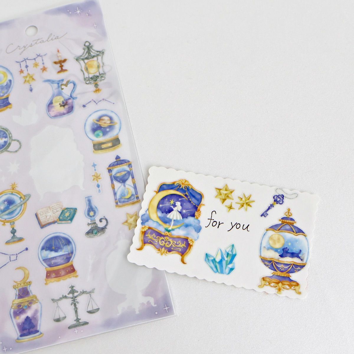 This is an illustration sticker that traps a fantasy world view and motif in a glass container like a snow globe or terrarium. It is a sparkling hologram specification.

• This package includes 1&nbsp;sheet of sticker
• Material: Transparent PET Hologram Lamination
• Package measures approx. H202 x W93 x D1mm
• Made in Japan