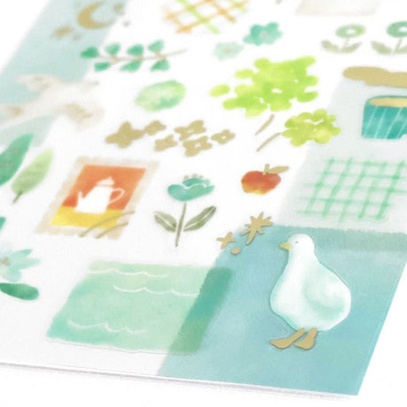 Set of decorative paper sheets with nature-themed designs including trees, a duck, and a cup.