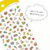 Sticker sheet with colorful food illustrations and a speech bubble on a white background.