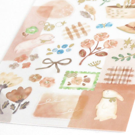 Sheet of decorative stickers with floral, bunny, and bow designs on a white background.