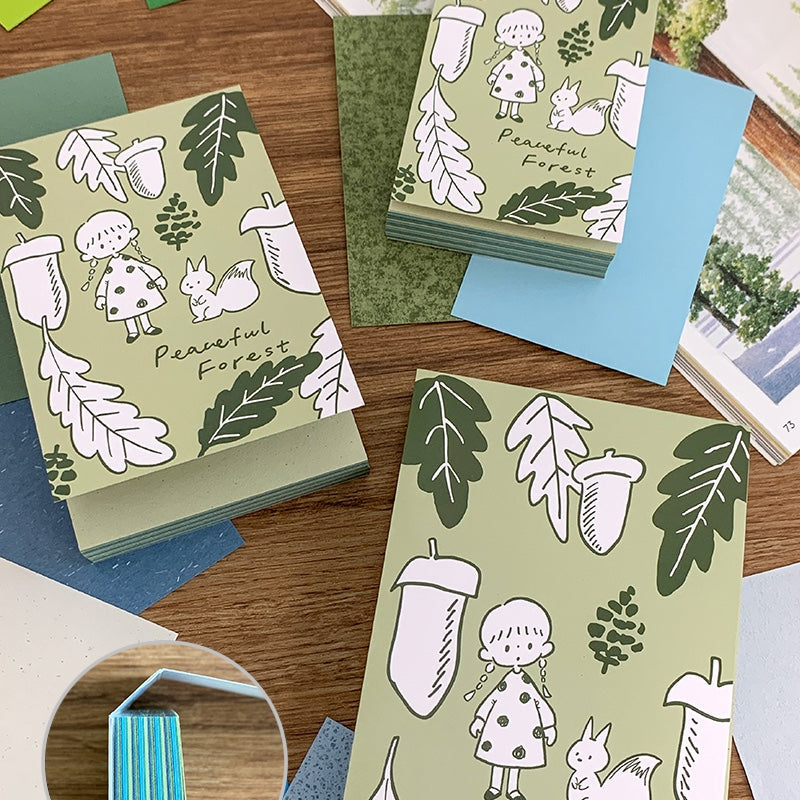 Molinta - Quiet Forest A7 Notepad

Enjoy 4 sets of 25 different designs that total to 100 sheets that have all kinds of specific texture characteristics to add charm to your journal!

Specifications: 80mmx120mm
Material: 300g super-sensitive paper
Inner page material: 100-130g mixed specialty paper
Full color pages inside
Quantity: 25 kinds of mixed specialty paper per book, 4 pages of each kind, 100 pages in total