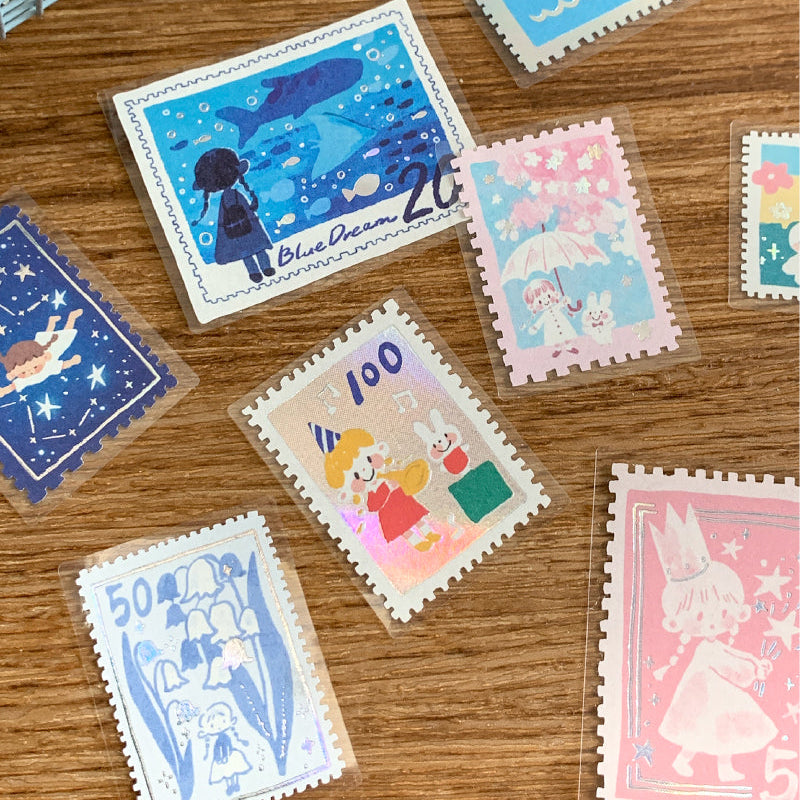 Molinta Postage Stamp Sticker Pack

Add a charming, vintage‑inspired touch to your journaling and crafting with these sticker packs. Designed to look like tiny collectible stamps, each one features delicate illustrations and foil accents that make every piece feel special. Whether you’re decorating planner spreads, pen‑pal letters, scrapbooks, or gift tags, these stickers bring a nostalgic, travel‑themed aesthetic to any project.

Red box - Gold foil
Blue box - Silver foil
Each box includes 30 total sticker