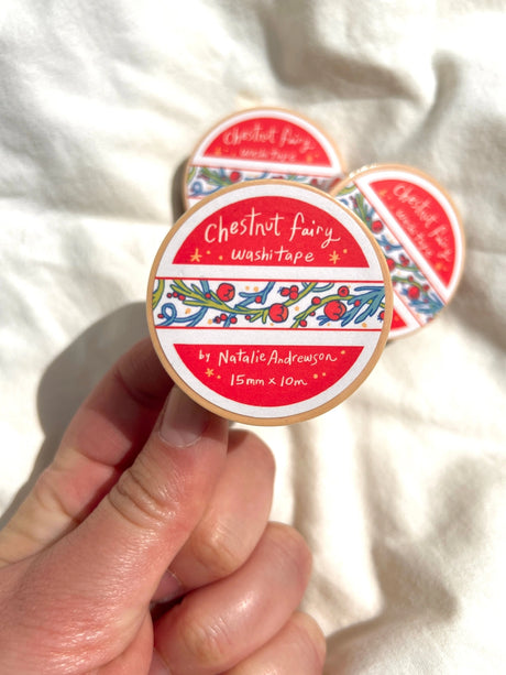 This washi tape was designed from my Chestnut Fairy Riso print! Looks like classic book art decorations with a vibrant red block separating each section.

This roll is 15mm wide x 10m of paper tape. Washi tape is super durable and flexible. It tears easily and can be safely applied to a variety of surfaces; it doesn’t leave a sticky residue behind, making it especially ideal for stationery and hanging prints temporarily.