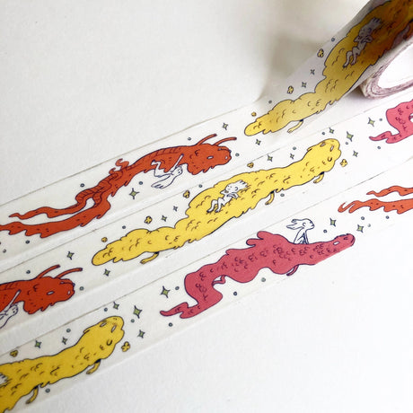 This Dragon washi tape features three soft, fluffy dragons that the dragon rider girl has befriended.

This roll is 15mm wide x 10m of paper tape. Washi tape is super durable and flexible. It tears easily and can be safely applied to a variety of surfaces; it doesn’t leave a sticky residue behind, making it especially ideal for stationery and hanging prints temporarily.