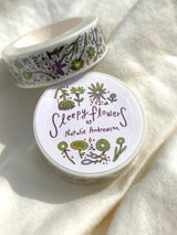 This washi tape features fluid green and purple flowers dancing loosely around to create an energetic, yet soft tape. 

This roll is 15mm wide x 10m of paper tape. Washi tape is super durable and flexible. It tears easily and can be safely applied to a variety of surfaces; it doesn’t leave a sticky residue behind, making it especially ideal for stationery and hanging prints temporarily.