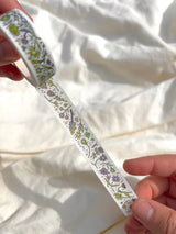 This washi tape features fluid green and purple flowers dancing loosely around to create an energetic, yet soft tape. 

This roll is 15mm wide x 10m of paper tape. Washi tape is super durable and flexible. It tears easily and can be safely applied to a variety of surfaces; it doesn’t leave a sticky residue behind, making it especially ideal for stationery and hanging prints temporarily.