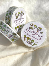 This washi tape features fluid green and purple flowers dancing loosely around to create an energetic, yet soft tape. 

This roll is 15mm wide x 10m of paper tape. Washi tape is super durable and flexible. It tears easily and can be safely applied to a variety of surfaces; it doesn’t leave a sticky residue behind, making it especially ideal for stationery and hanging prints temporarily.