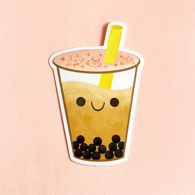 Cartoon bubble tea with a smiley face on a pink background