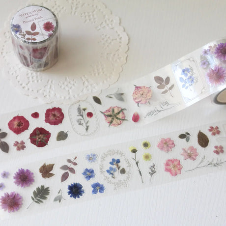 This pressed flower PET tape is designed for journalers, botanical enthusiasts, and stationery lovers drawn to the delicate beauty of real pressed florals. Featuring scanned camellias, delphiniums, blue cardinals, and plum blossoms, each flower is pre-cut and ready to peel.

Extra wide at 50mm with a shiny finish that layers beautifully over any journal page, envelope, or scrapbook layout.

Size: 50mm x 10m
