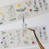 An updated version of our Wildflower PET tape, now with a longer 50cm designer loop for even more creative possibilities.

This wildflower PET tape is designed for journalers, collagers and stationery lovers who want to bring the beauty of the British countryside into their creative projects. Featuring hand-painted watercolour flowers by Rebecca, each illustration is pre-cut and ready to peel - no scissors needed.

Extra wide at 50mm with a matt transparent finish that layers beautifully over any journal pa