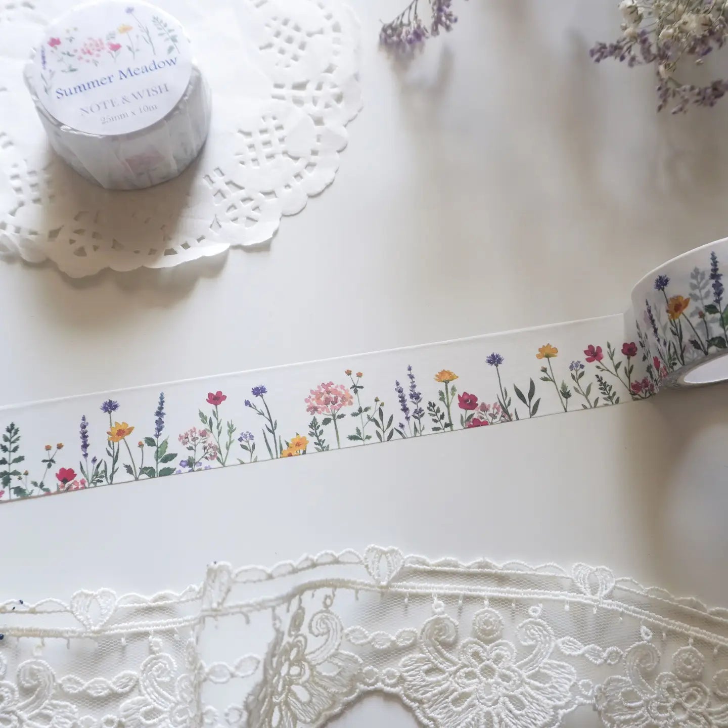 This wildflower washi tape is inspired by long summer walks through British meadows in full bloom. Featuring hand-drawn cornflowers, lavender and red flax, it captures that warm feeling of a summer afternoon surrounded by wildflowers. Designed and hand drawn in the UK by Rebecca.

Length: 10m&nbsp;
Width: 25mm