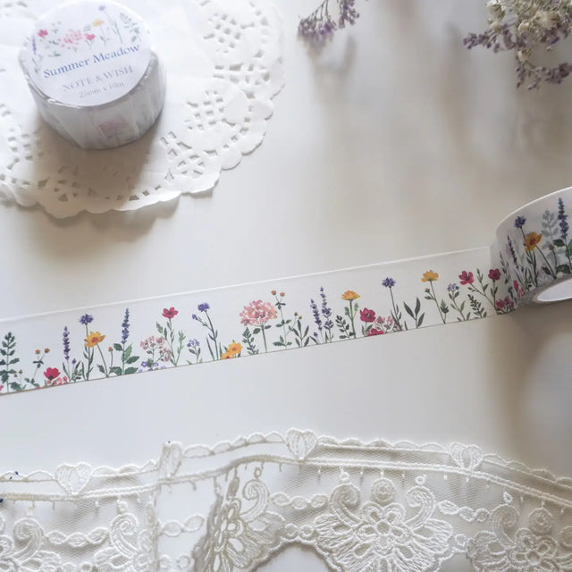 This wildflower washi tape is inspired by long summer walks through British meadows in full bloom. Featuring hand-drawn cornflowers, lavender and red flax, it captures that warm feeling of a summer afternoon surrounded by wildflowers. Designed and hand drawn in the UK by Rebecca.

Length: 10m&nbsp;
Width: 25mm