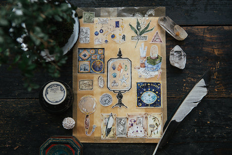 OURS Studio Collection of Museum Washi Tape Collection of vintage-style cards on a wooden surface with crystals and a feather.