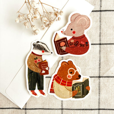 A charming sticker set for everyone who loves quiet evenings, cozy corners, and good books 📚🧡 This vinyl sticker pack features three cute animals enjoying their favorite reads - perfect for decorating your journal, planner, book cart, or laptop. A sweet gift idea for bookworms and cozy lovers alike!