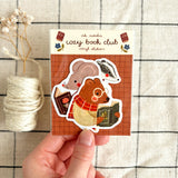 A charming sticker set for everyone who loves quiet evenings, cozy corners, and good books 📚🧡 This vinyl sticker pack features three cute animals enjoying their favorite reads - perfect for decorating your journal, planner, book cart, or laptop. A sweet gift idea for bookworms and cozy lovers alike!