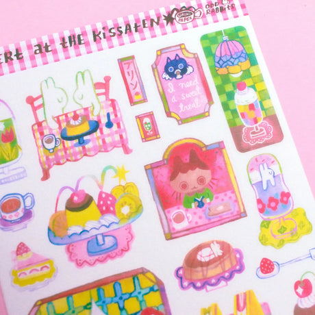 'Dessert at the Kissaten' A6 Washi Sticker Sheet. The material of the sticker sheet is a thin washi paper that is great for journaling!

Sticker sheets are not waterproof and should not be placed in areas of heavy wear (phone cases, laptops, water bottles, etc).
Great for journaling or decorating flat spaces!
Sticker sheets come in a plastic sleeve.
