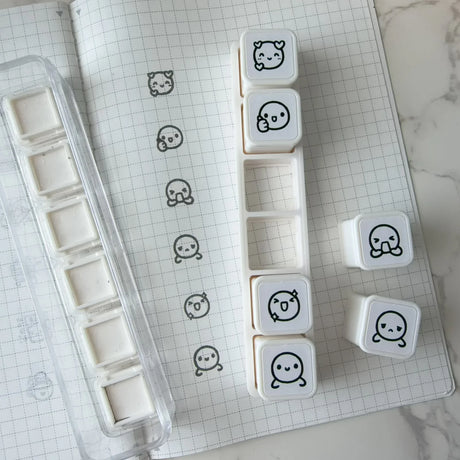 Once More With Love 6 in 1 Punch Stamp - Munchkin Emotions

6-in-1 removable stamps for expressing emotions through Munchkins!

Can be used right in the bracket or taken out for more precise stamping. The stamps are self-inking and come in a transparent case!

***IMPORTANT:&nbsp;Stamps come very well inked. Make sure you use scrap paper to stamp off excess ink prior to using in your notebooks

STAMP SET SIZE:&nbsp;10.75cm&nbsp;(L) x 2.5cm (W) x 2.75cm (H)
INDIVIDUAL STAMP SIZE:&nbsp;1.5cm x 1.5cm
INK COLOUR