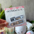 Celebrate your love for writing, planning, and creativity with the Once More With Love Sticker Pack – Pen Collection. This charming ephemera set is perfect for planners, journalers, and scrapbookers who enjoy adding personality and playful detail to their pages. Featuring adorable pen‑themed designs, this pack brings a fun, whimsical touch to any creative project.

Includes 12 Stickers